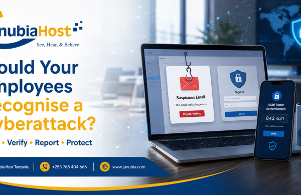 Banner advertising cybersecurity awareness: 'Would Your Employees Recognise a Cyberattack?' with a laptop showing a phishing alert and a mobile device for multi-factor authentication alongside JunubiaHost branding.